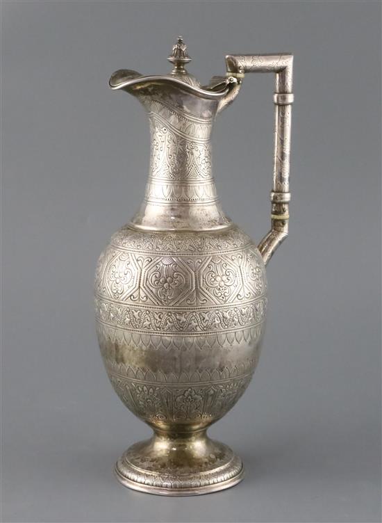 A Victorian engraved silver baluster hot water/claret jug, by Atkin Brothers, 18.5oz.